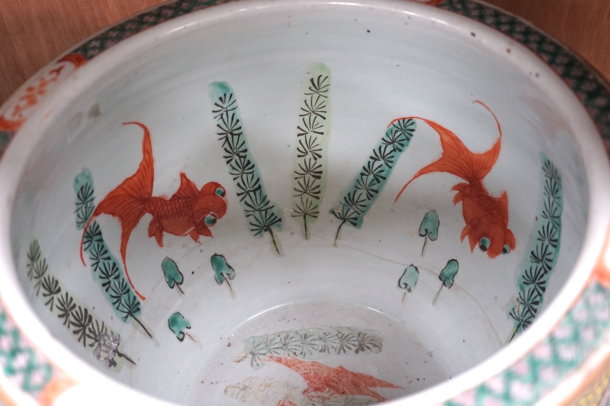 A Chinese famille rose goldfish bowl, Guangxu period, 25cm high. Condition - repaired